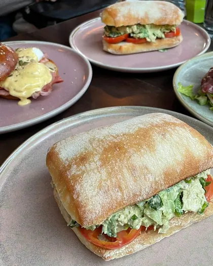 Sandwiches and the breaky burger on pastel plates