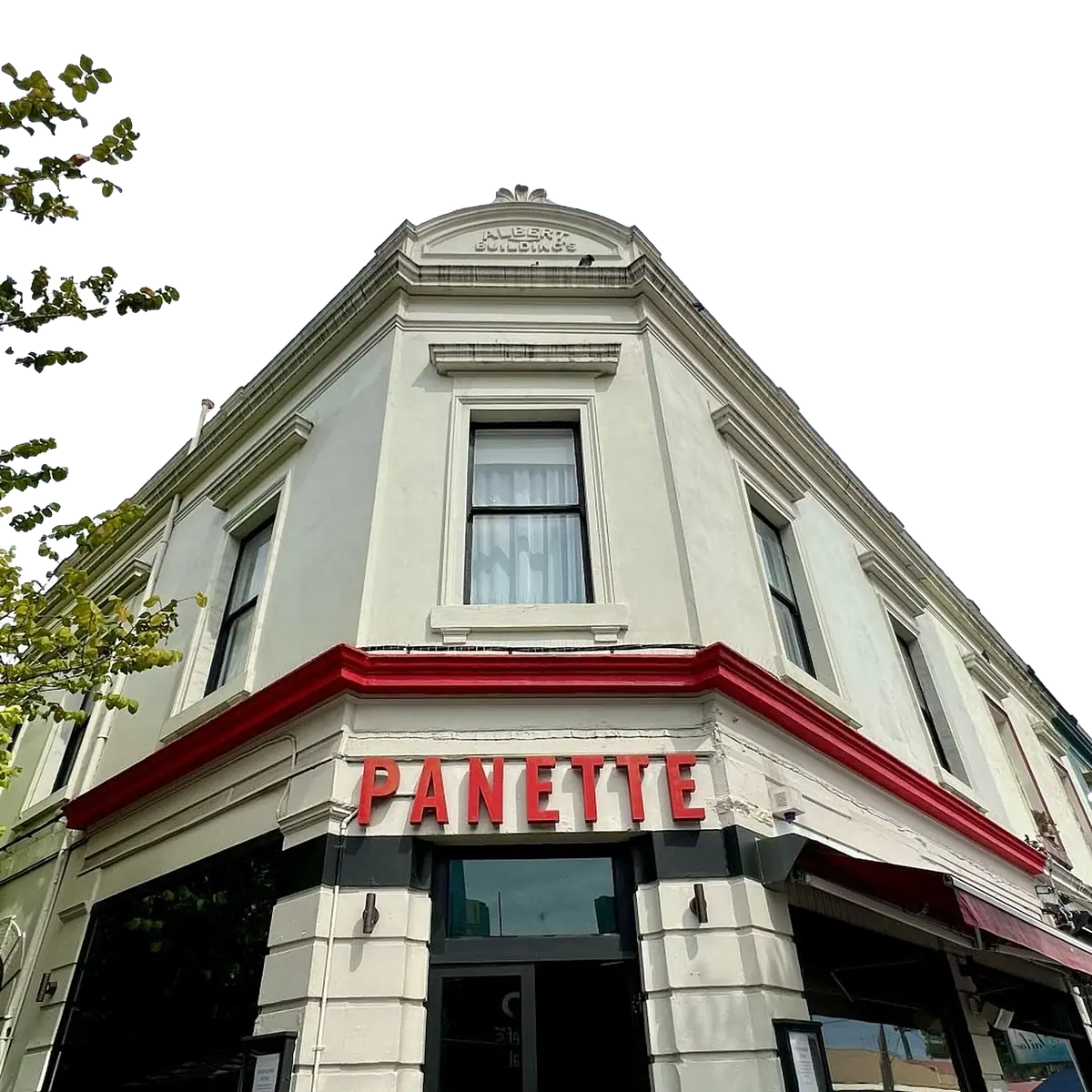 The Albert Buildings on Cecil St, South Melbourne: a white heritage corner building with a red cornice and the red PANETTE sign above the door