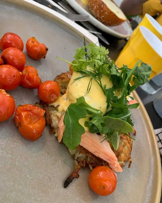Smoked trout eggs benedict with hollandaise and herbs